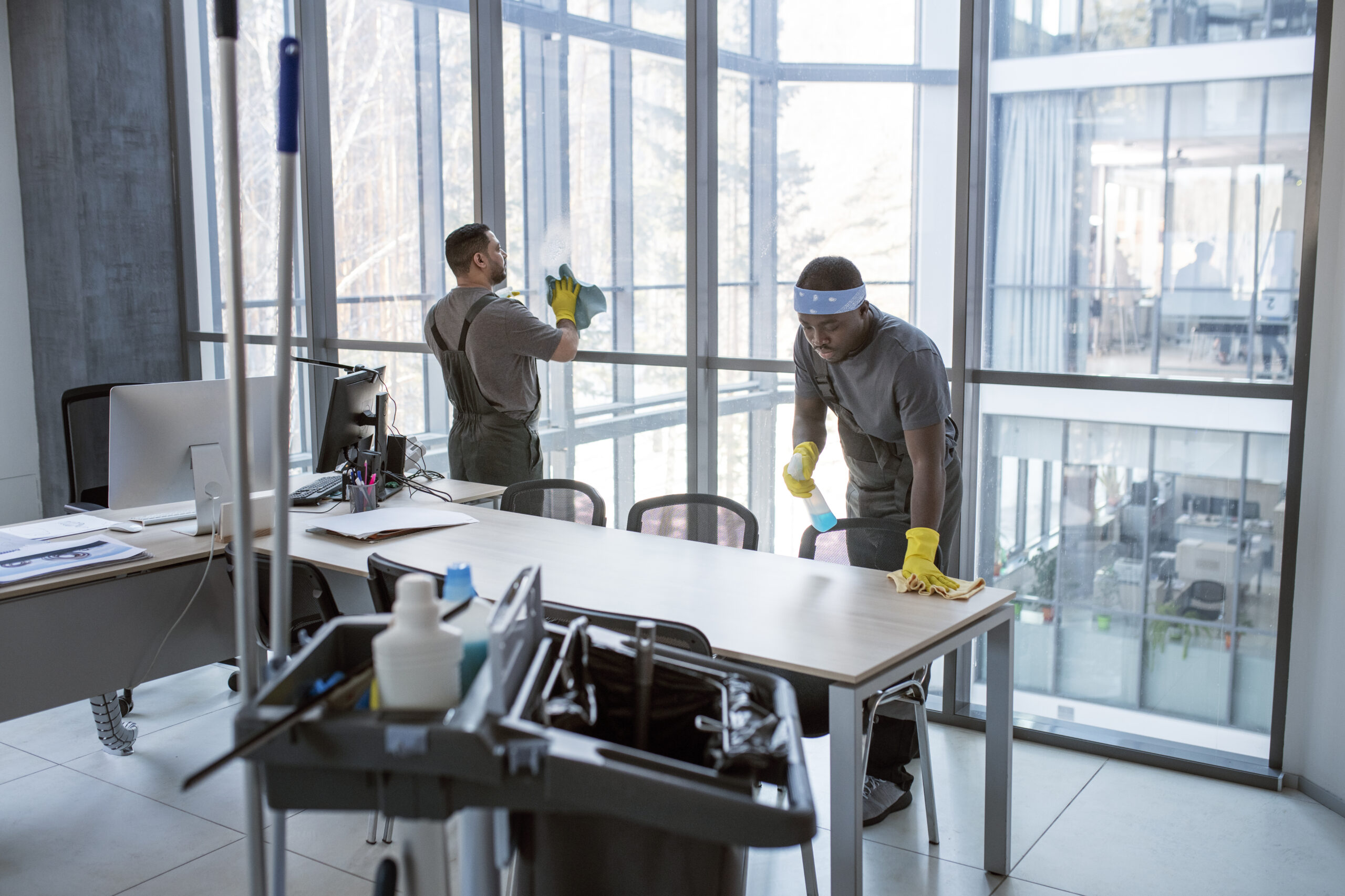 full shot men cleaning office scaled
